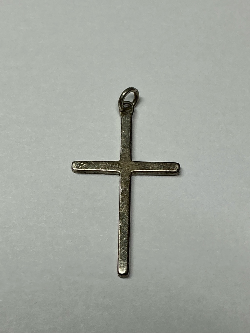 Sterling Silver Petite Cross Pendant in Silver. 1 inch long